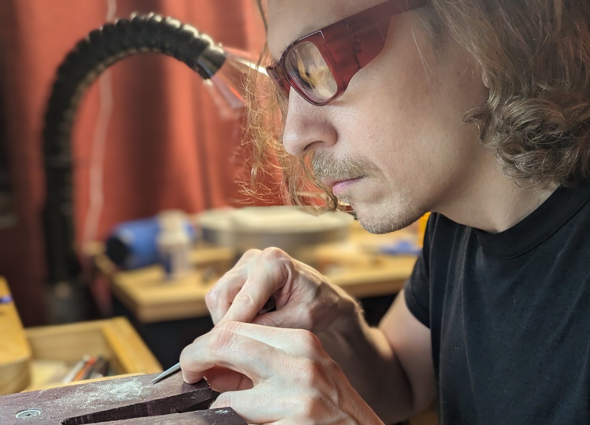 Saxon Burns working by hand at his jeweler’s bench in Phoenix.