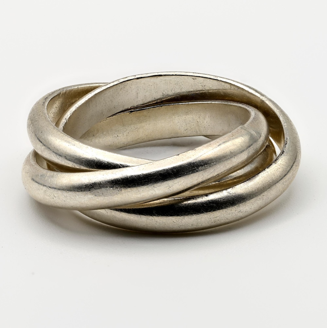 Interlocking handmade sterling silver rings.