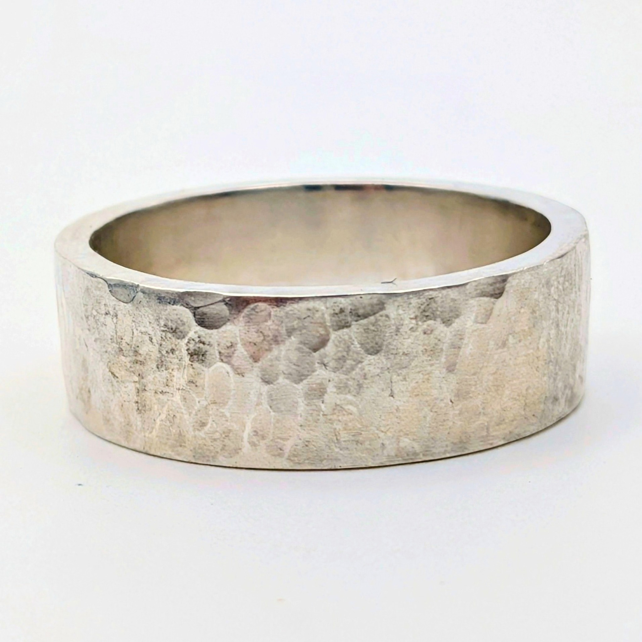 Mesa Wedding Band: wide hammered sterling silver band.