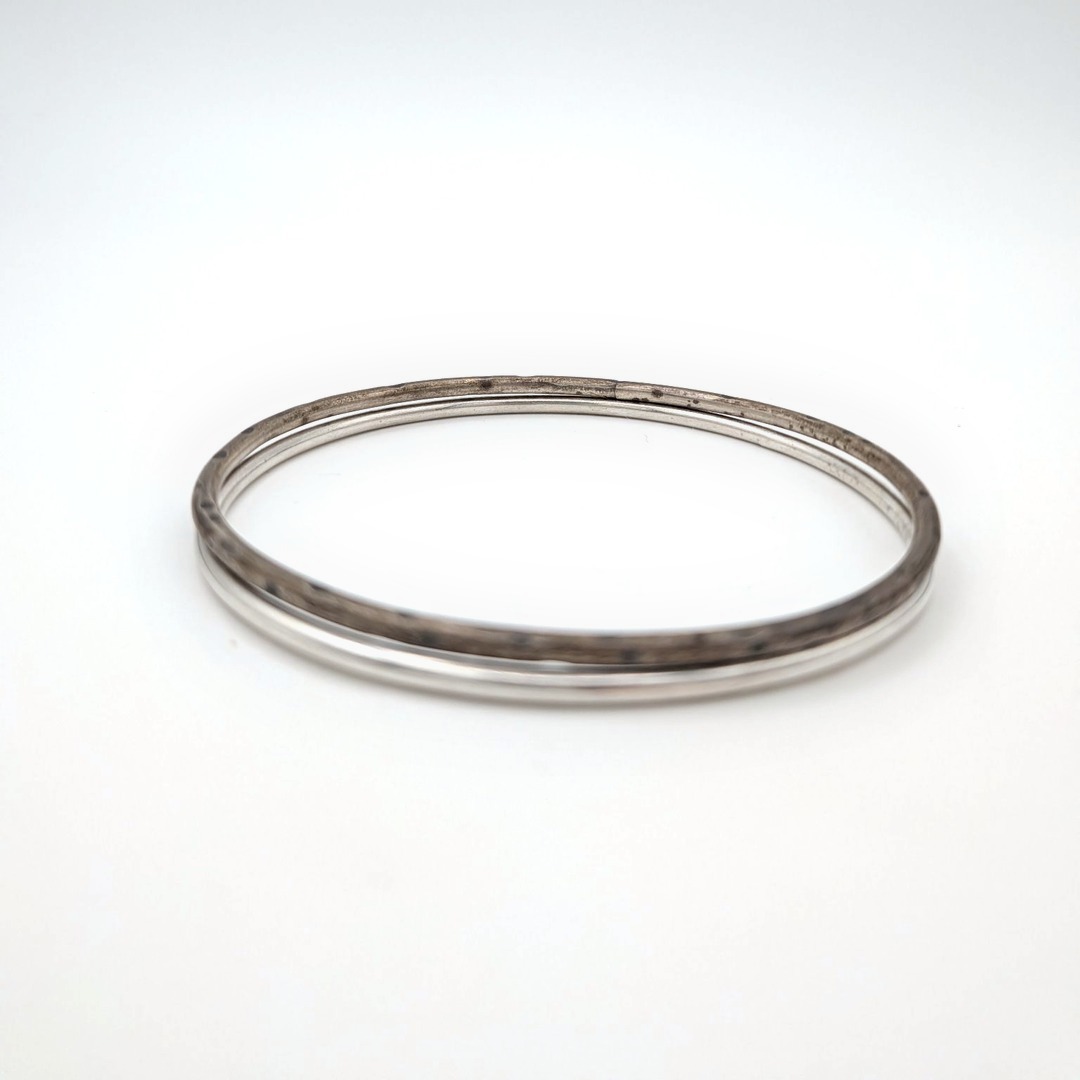 Valence Bangle Pair: one polished and one dark hammered sterling silver bangle.